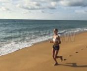 Get 100&#39;s of FREE Video Templates, Music, Footage and More at Motion Array: https://www.bit.ly/2UymF81nnnnGet this here: https://motionarray.com/stock-video/beach-jogger-with-headphones-140637nnThis video follows a fit woman during her morning run on the beach. She got an early start to her day, no one else is on the beach. The sand is still wet from the receding tide. She jogs in a white sports bra and black shorts. She listens to music on her headphones. Use this video to encourage healthy beh