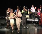 Ron Privett sings and Steve Conrad and Lacey Maynard dance the Cotton Eyed Joe while Doc Rolland’s Americana String Ensemble plays Doc’s arrangement of this classic traditional fiddle number in the band’s China tour. The 9-piece acoustic band plus two dancers and an interpreter gave 24 concerts at major civic venues throughout China in August 2014. The program featured fiddling, cowboy, country, Celtic, Cajun, swing, bluegrass and old-time music. Traveling by bus, bullet train and airplane