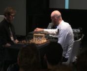 “REUNI0N2012: A novel interface for sound producing actions through the game of chess – Adaption for Kyma” is a work for electronically modified chessboard, two performers/chess players and the Kyma system.nnThe idea behind REUNI0N2012 is to reflect the chess games flow and dynamics through sound by using a chessboard equipped with high resolution hall-effect sensors which register movements on the board, sends the data stream (OSC) to the two performers, which in turn result in various so
