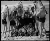 1935., USAnn Homemade Diving Suits Used In Sean02:31:17Diving helmets lifted by pairs of bathing beauties onto men; then pump air pumps as men walk into ocean to test.n02:31:35CU girls bottoms while pumping; men in water.Underwater footage of menpretty girl inside under kelp / seaweed.nStunts; Gags; Oddities; Venice, California; 1935;