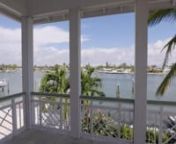 This spectacular Key West inspired home sits on a double lot in Sunset Beach and offers the finest in Coastal Living. With sweeping views from terraces off almost every room in the house you can enjoy the sunrise with a cup of coffee, get a mid-day tan, or eat dinner while watching the sunset. With just two minutes of bridge-free travel to the Gulf of Mexico, the 100 feet of waterfront features a composite dock with electricity and water, with a 13,000-pound boat lift. The dock previously accomm