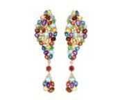 https://www.ross-simons.com/882079.htmlnnConfectionery colors make this pair oh-so-sweet! The drop earrings dangle red corundum with 13.60 ct. tot. gem. wt. clusters of garnet, amethyst, peridot, citrine, London and sky blue topaz, orange sapphire, green tsavorite, and tanzanite. Set in 14kt yellow gold over sterling silver. Hanging length is 2 1/4. Post/clutch, multi-stone drop earrings.