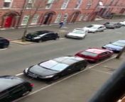 Female tries to park her car, taking easily 30 mins altogether.