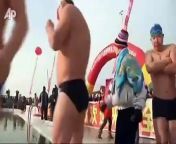 Hundreds of people compete in a Polar Bear Swim Invitational in Northeastern China. The pool is carved out of a frozen river.