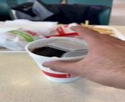 This person was demonstrating how to open a soda cap to his son. However, as they were closing the lid, they accidentally spilled the soda on the table.